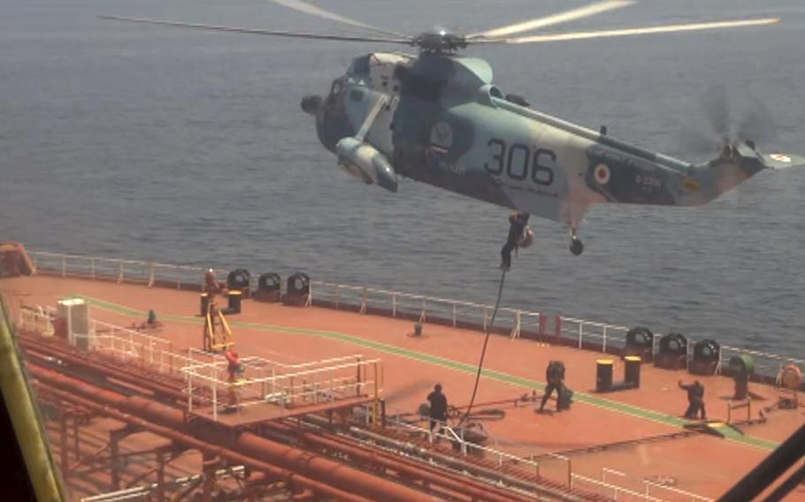 In this frame grab from video released Friday April 28, 2023, Iranian marines rappel onto the Advantage Sweet, a Marshall Islands-flagged oil tanker’s deck in the Gulf of Oman. Iran’s navy seized a Marshall Islands-flagged oil tanker in the Gulf of Oman on Thursday heading to the U.S. amid wider tensions over Tehran’s nuclear program, the latest-such capture in a waterway crucial for global energy supplies. 