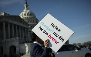 An advocate holds a sign for TikTok following a news conference outside the U.S. Capitol on Tuesday, March 12, 2024. MUST CREDIT: Graeme Sloan/Bloomberg