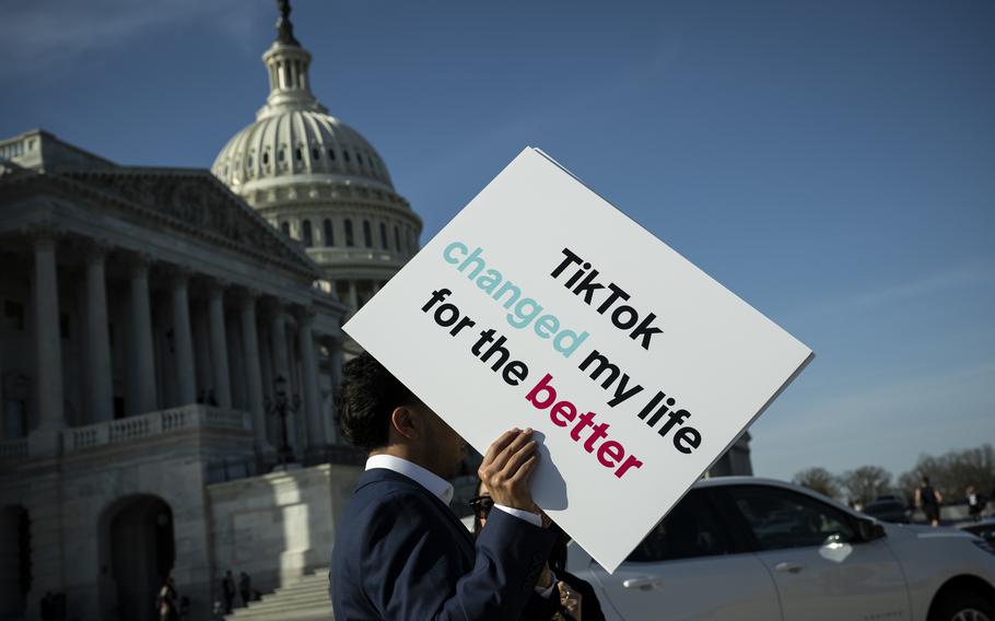 An advocate holds a sign for TikTok following a news conference outside the U.S. Capitol on March 12, 2024. 