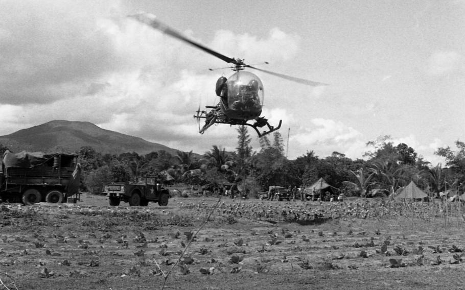 A Scout H-13 helicopter takes off during Operation White Wing at Bong Son. The helos refuel, and pilots get briefed on the operation at the LZ. 