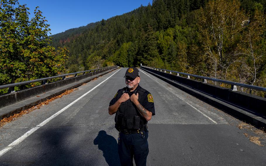 Yurok Tribal Police Chief Greg O’Rourke on Oct. 5, 2022, stands on the bridge in Pecwan, California, where Emmilee Risling was last seen before she disappeared in October of 2021 on a rural Native American reservation in Humboldt County. 