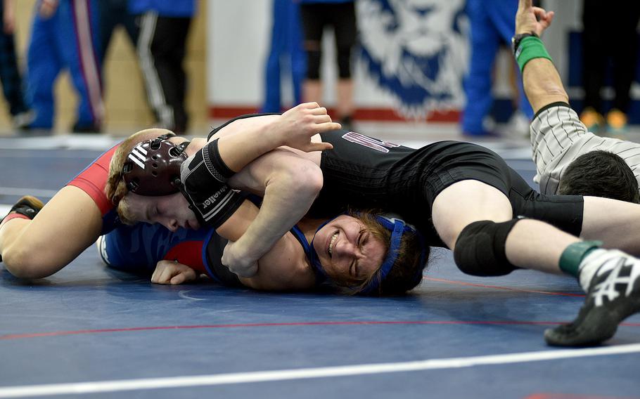 Vilseck’s Christopher Wissemann tries to pin Ramstein’s Liberty Snyder during the third-place match for 113 pounds at a tournament at Ramstein High School on Ramstein Air Base, Germany.