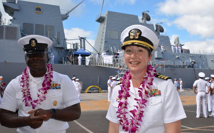 DonAnn Gilmore, commander of the future USS Daniel Inouye, and Simeon Yerboh, the ship’s command master chief, speak with reporters beside the ship at Joint Base Pearl Harbor-Hickam, Hawaii, Nov. 18, 2021.