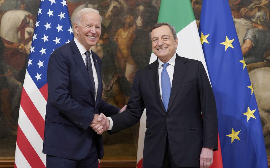 U.S. President Joe Biden, left, shakes hands with Italy's Prime Minister Mario Draghi prior to a ceremony at the Chigi Palace in Rome, Friday, Oct. 29, 2021.