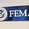 FILE - A sign for the Federal Emergency Management Agency is pictured at FEMA headquarters, April 20, 2020, in Washington. (Al Drago/The New York Times via AP, Pool)