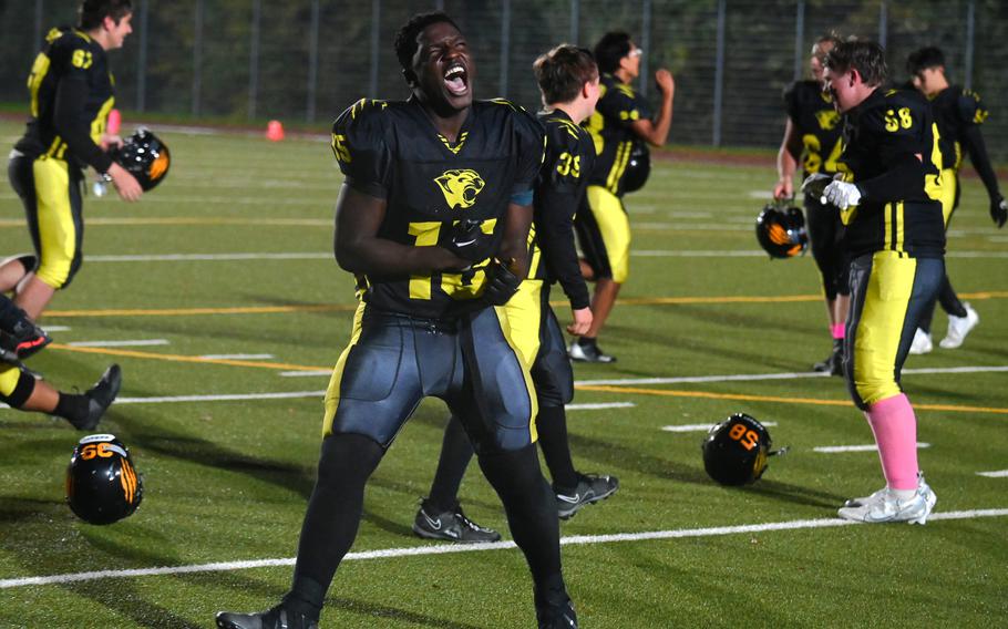 Stuttgart’s Maurice Korie celebrates the Panthers third consecutive championship after their game against the Vilseck Falcons on Oct. 28, 2023, at Stuttgart High School. Korie came up big for the Panthers recording the game’s only defensive touchdown with a pick six in the second half. 