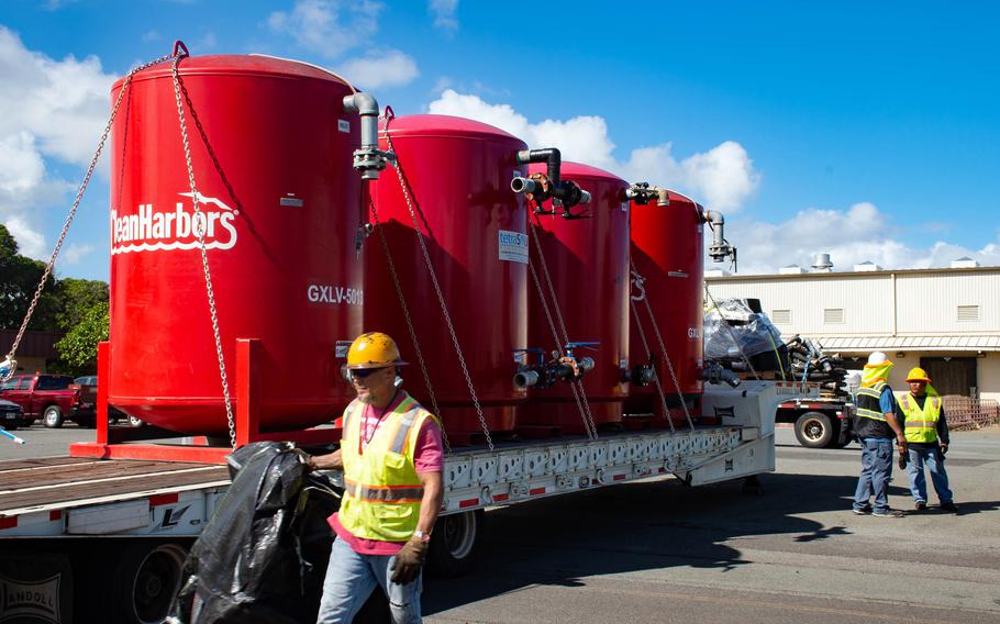 Navy personnel prepare massive carbon filter systems on Dec. 18, 2021, that will be used to flush contaminated water from military communities near Joint Base Pearl Harbor-Hickam, Hawaii.