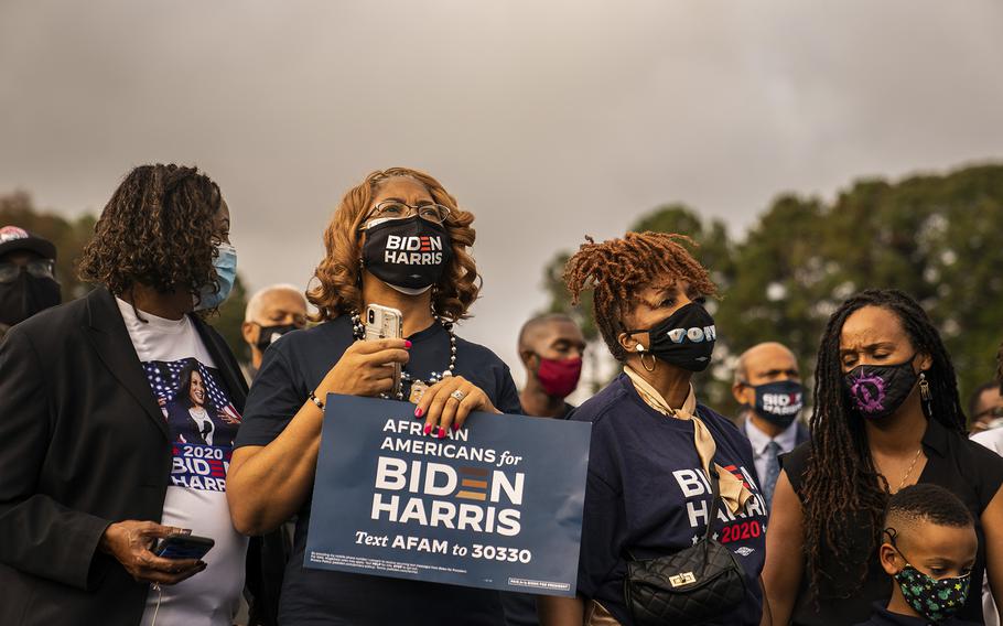 Supporters listen to then-presidential nominee Joe Biden during a campaign event in Atlanta in October 2020. 