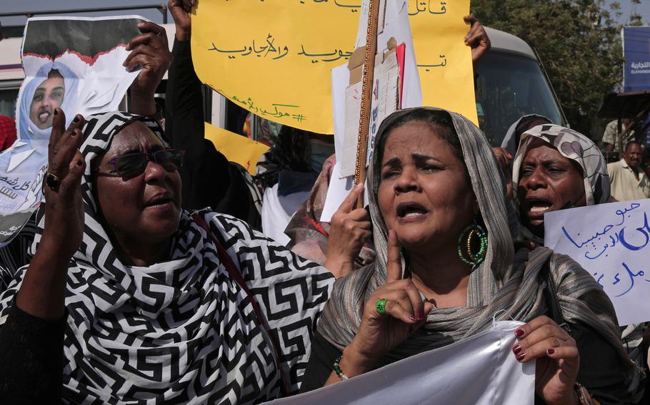 Women chant slogans against the killing of demonstrators in street protests triggered by an October military coup, in the twin city of Omdurman, about 18 miles northwest of the capital Khartoum, Sudan, Tuesday, Jan. 11, 2022.