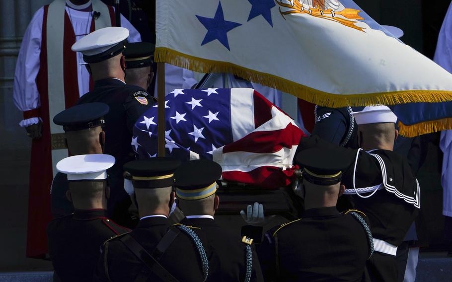 The flag-draped casket of former Secretary of State Colin Powell is carried into the Washington National Cathedral for a funeral service in Washington, Friday, Nov. 5, 2021. 