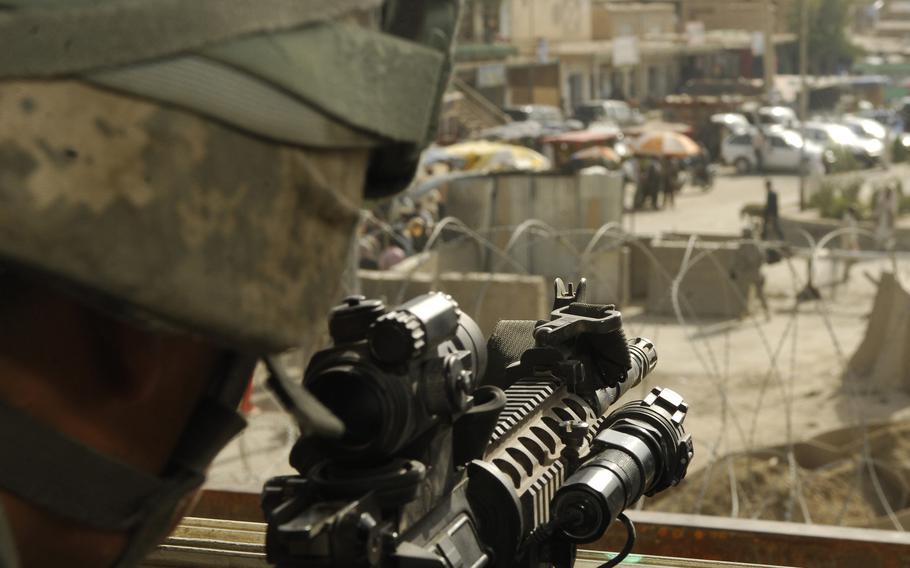 From his overwatch tower, U.S. Air Force Staff Sgt. Steven Lugo-Velez can see much of the town surrounding Bagram Airfield, Afghanistan in 2009. 