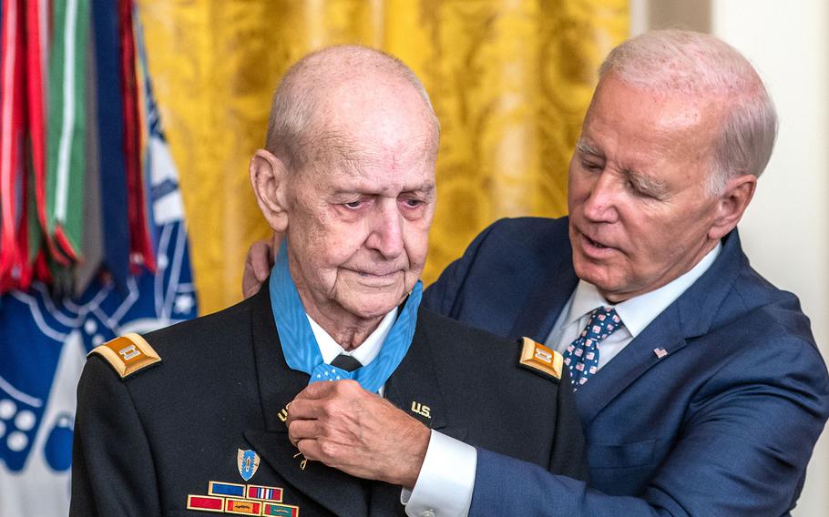 President Joe Biden adjusts the Medal of Honor he just placed around his neck of Vietnam veteran Larry Taylor during a ceremony at the White House on Tuesday, Sept. 5, 2023.