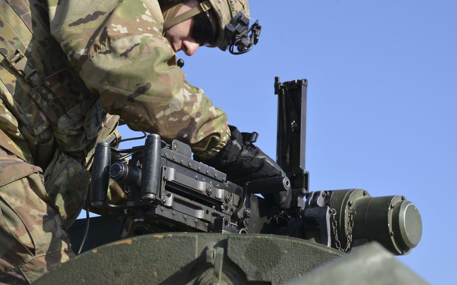 Army 1st Lt. Don Sparaco, a Stryker commander with 8th Squadron, 1st Cavalry Regiment, 2nd Stryker Brigade Combat Team, inspects an M-2 Browning machine gun during an exercise at Rodriguez Live Fire Complex in Pocheon, South Korea, Tuesday, Jan. 10, 2023.