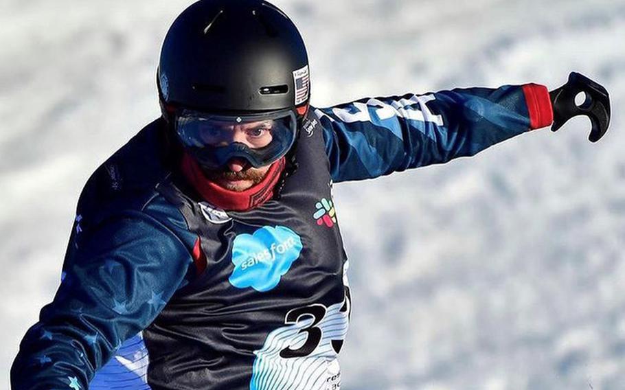 Michael Spivey, a former Marine who lost his left arm after a December 2010 bomb blast in Afghanistan, is snowboarding for Team USA at the Paralympics in Beijing. 