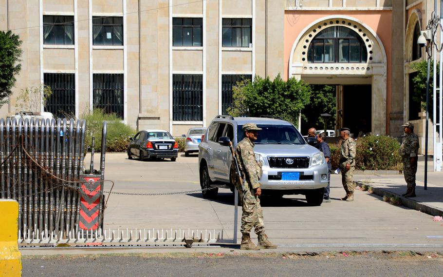 Houthi security forces stand guard outside the Foreign Ministry in Sanaa, Yemen, on Feb.5, 2024.