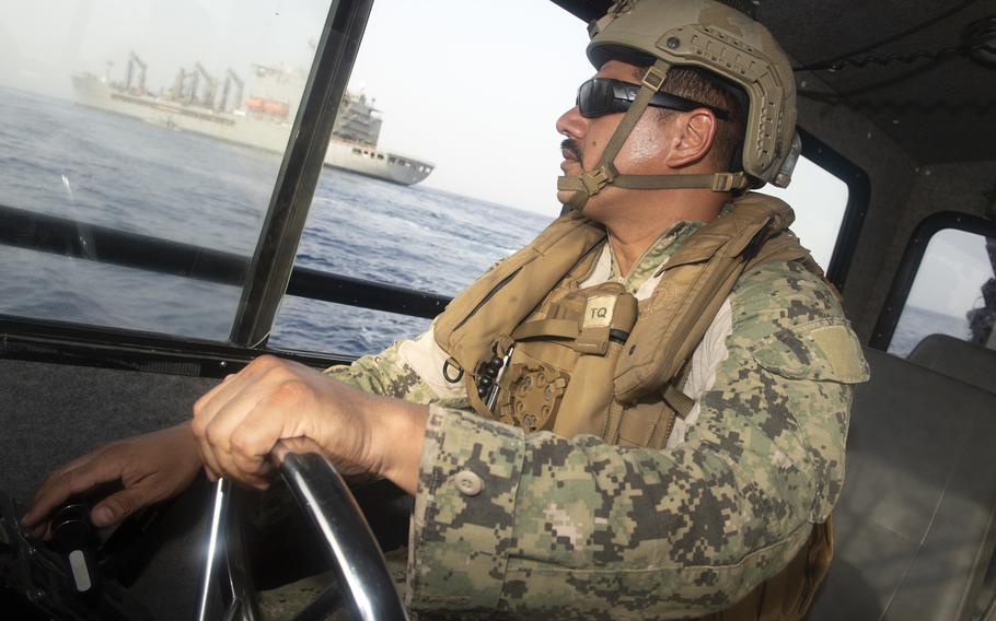 Petty Officer 1st Class Edgar Ardon, with Maritime Expeditionary Security Squadron Eleven, based at Camp Lemonnier, Djibouti positions his boat closer to USNS Patuxent, June 17, 2021, to pick up four Somali fishermen rescued the previous day from a disabled fishing boat. The fishermen were stranded at sea for 12 days after a mechanical failure.