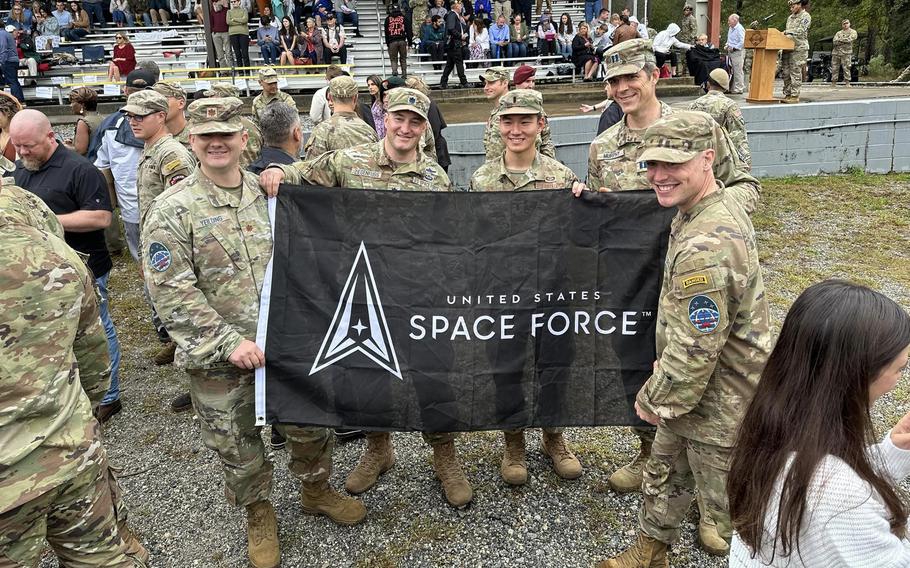 Space Force Capt. Daniel Reynolds, on the right in front of the flag, graduated Oct. 13 from the Army-run combat leadership course, earning the coveted Ranger Tab and marking the Space Force’s first completion of the weekslong combat leadership course.