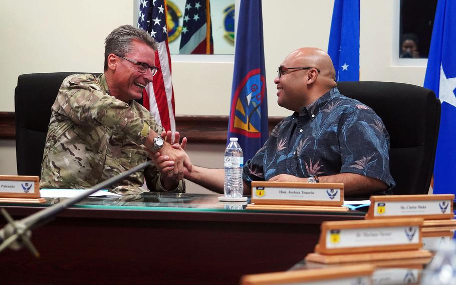 Brig. Gen. Thomas Palenske and Guam Lt. Gov. Josh Tenorio shake on an agreement.