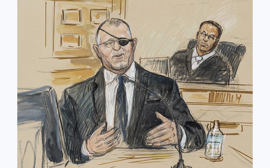 An artist sketch depicts the trial of Oath Keepers leader Stewart Rhodes, left, as he testifies in Washington on Nov. 7, 2022, before U.S. District Judge Amit Mehta on charges of seditious conspiracy in the Jan. 6, 2021, attack on the U.S. Capitol.