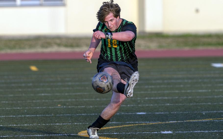 Robert D. Edgren's Cole Donnelly sends the ball upfield against Nile C. Kinnick during Friday's DODEA-Japan boys soccer match. The Red Devils won 5-0.