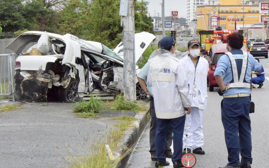 Okinawa police say a Marine was killed Saturday, May 14, 2022, after the car he was driving veered off Route 58 and crashed into a light pole and pedestrian fence outside Camp Foster, Okinawa.