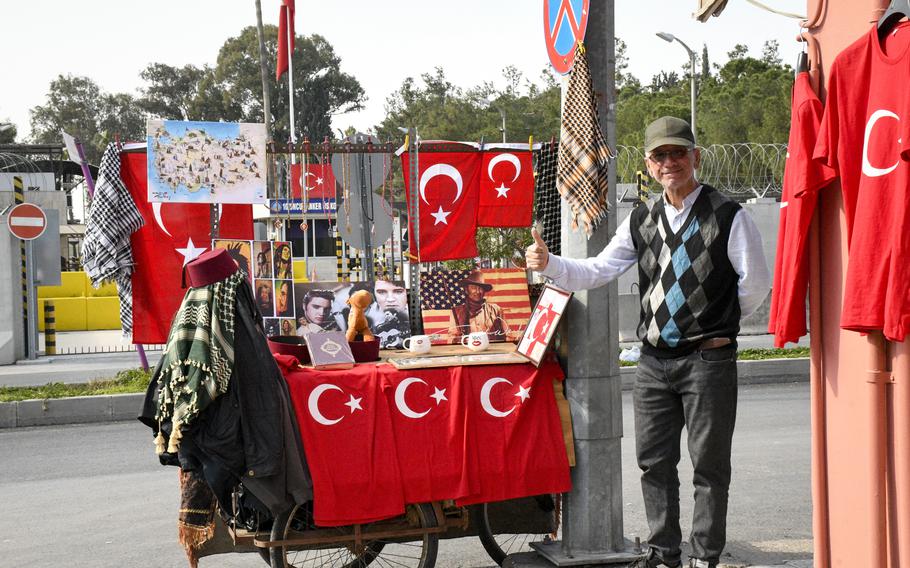 A Turkish merchant sells Elvis Presley, John Wayne and Bob Marley paraphernalia in an attempt to draw in American customers outside Incirlik Air Base in southern Turkey on Feb. 25, 2023.