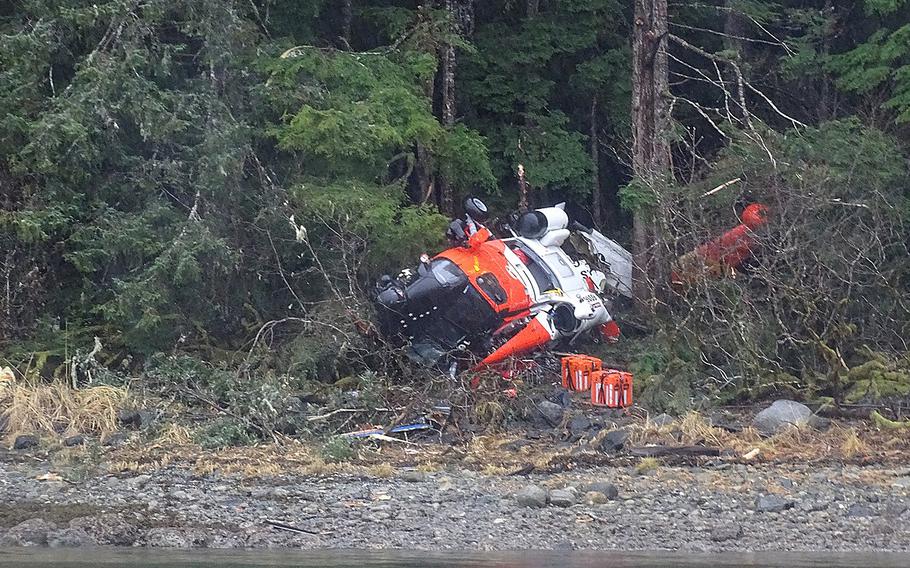 The wreckage of a Coast Guard MH-60 Jayhawk helicopter from Air Station Sitka is seen Nov. 14, 2023, after it crashed on Read Island, Alaska, on Nov. 13, at approximately 11:05 p.m.