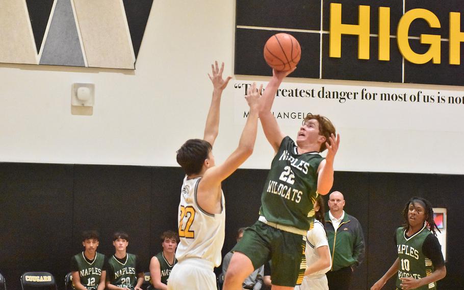 Naples’ Camden Kasparek puts up a shot late in the fourth quarter over Vicenza’s Michael Darland in the Cougars’ 65-49 victory over the Wildcats on Friday, Feb. 2, 2024.