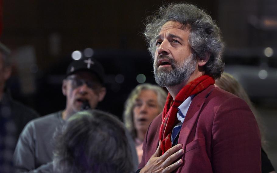 David Clements, a former New Mexico State University professor, recites the Pledge of Allegiance on Thursday at a demonstration outside a D.C. jail. 