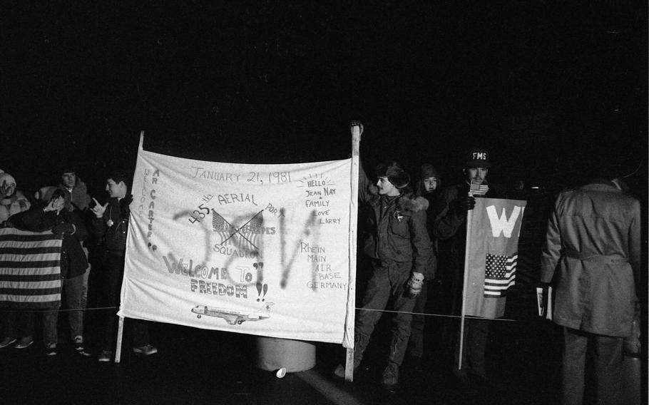 Thousand of well-wishers gathered at Rhein-Main Air Base with signs and banners to welcome the 52 Americans held captive in Iran since Nov. 4, 1979, to freedom. The Americans had been held captive in Iran for 444 days after some 300 militant Iranians seized the U.S. Embassy in Tehran.