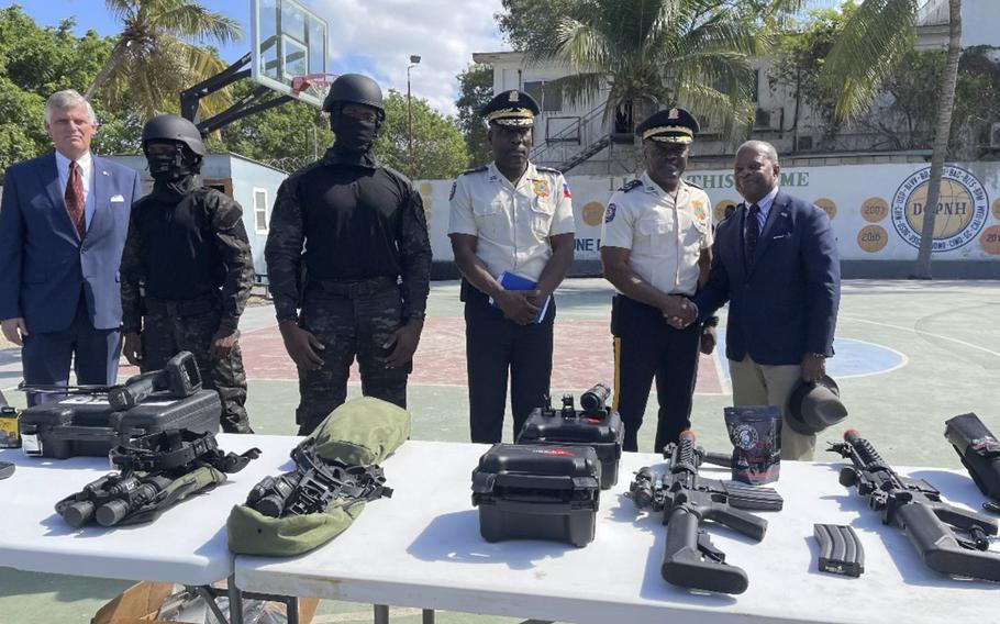 Todd Robison, an assistant secretary of state in charge of the Bureau of International Narcotics and Law Enforcement Affairs seen at far right, visited Port-au-Prince, Haiti, in late January 2023, during a trip that coincided with rioting by police after two gang attacks in five days left 11 police officers dead.