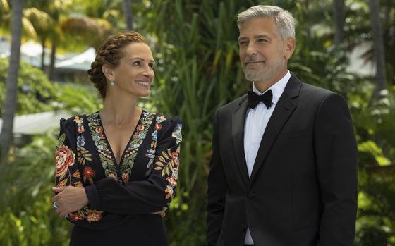 Julia Roberts, left, and George Clooney star in “Ticket to Paradise.”
