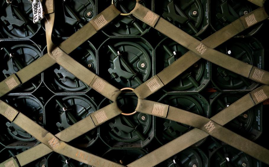 A pallet of explosive charges for 155mm artillery ammunition bound for Ukraine via a commercial plane sits on a loading bay at Dover Air Force Base in Dover, Del.