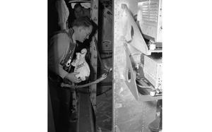 Somewhere above Germany, Oct. 18, 1949: Capt. Eugene T. Williams, U.S. Air Force assistant German Youth Activities officer, prepares to throw a Schmoo full of candy out of the Bon Bon Bomber. The B-17 Bon Bon Bomber flew from Wiesbaden Air base to drop some 80,000 candies over displaced persons camps at Ludwigsburg, Heilbronn, and Schwabisch-Gmund. It also dropped some sweets over the orphanage at Bad Aibling Oct. 18, 1949 as well as Frankfurt and Darmstadt. 
It was the last time that chocolate bars, boxes of lemon drops and other delicious things attached to tiny white parachutes were dropped from the sky as "Operation Little Vittles" ended. The operation started in 1948 when 1st Lt. Gale Halvorsen, a pilot flying one of the many C-54 cargo planes in the Berlin Airlift, wanted to lift the spirits of the children of Berlin with candy drops from his plane. The initially unauthorized operation grew to a multitude of airlift pilots dropping candy over Germany for two years.

Do you know a "candy bomber"? Help us solve a mystery and identify all the members of the last Candy Bomber crew! Read the original article and see the photograph here.

META TAGS: Europe; Germany; post-war; Operation Little Vittles; Berlin Airlift; candy bomber; goodwill