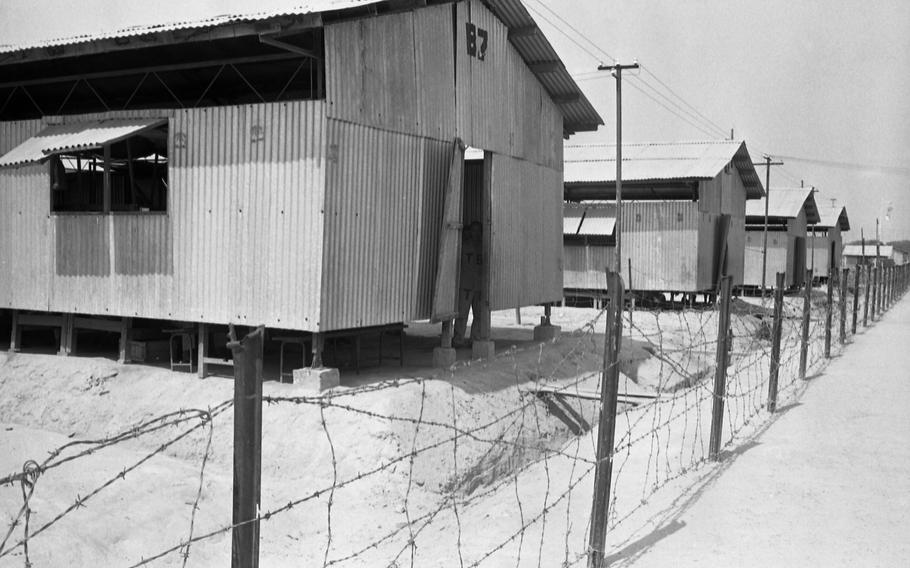The Bien Hoa prisoner of war camp is a compex of 55 buildings — barracks, kitchens, mess halls, libraries, and a dispensary with a doctor.