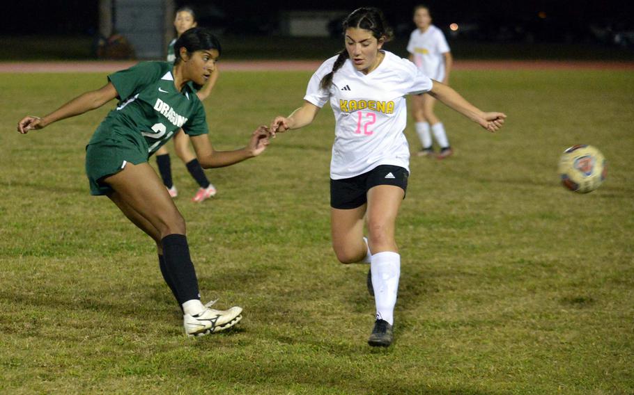 Kubasaki's Solares Solano boots the ball past Kadena's Sophia Fineman during Wednesday's DODEA-Okinawa girls soccer match. The Dragons beat the Panthers 1-0 for the second time in two weeks.