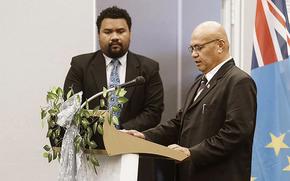 In this photo provided by the Tuvalu government, the newly elected Prime Minister, Feleti Teo, right, is sworn into office during a ceremony in Funafuti, Tuvalu, on Feb. 28, 2024.