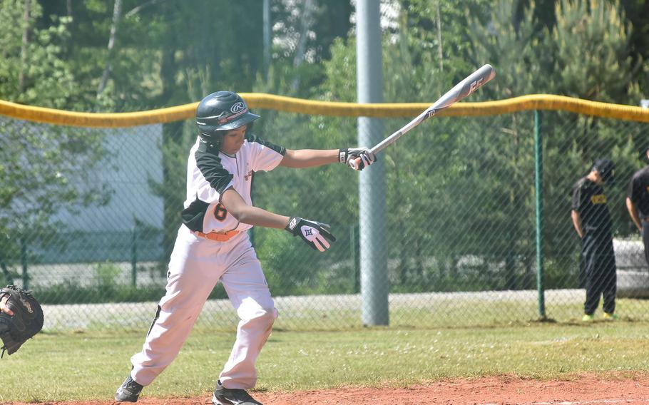 Spangdahlem's Matt Martinez follows through on a swing that made contact with the ball, putting it in play in the Sentinels' 10-6 loss to Vicenza, on May 19 2023, in the DODEA-Europe Division II/III baseball championships in Kaiserslautern, Germany.