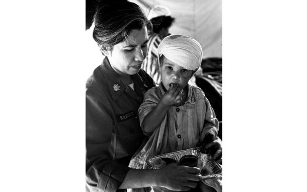 Kumanovo, Yugoslavia, July, 1963: At a tent city in Kumanovo, Maj. Rosa Ramirez feeds a three-year-old survivor of the July 26 earthquake that killed over 1,000 people and leveled most of the city of Skopje. The fate of the girl's parents was still unknown. The tent city was set up by the 8th Evacuation Hospital of Landstuhl, Germany, from which 200 doctors, nurses and other personnel were flown in to Belgrade by the 322nd Air Division and then driven on trucks and buses over 250 miles of bad roads.
Want more of Stars and Stripes’ historic content? Subscribe to Stars and Stripes’ historic newspaper archive! We have digitized our 1948-1999 European and Pacific editions, as well as several of our WWII editions and made them available online through https://starsandstripes.newspaperarchive.com/
META TAGS: Yugoslavia, natural disaster, earthquake, humanitarian aid, U.S. Air Force, U.S. Army, military medical