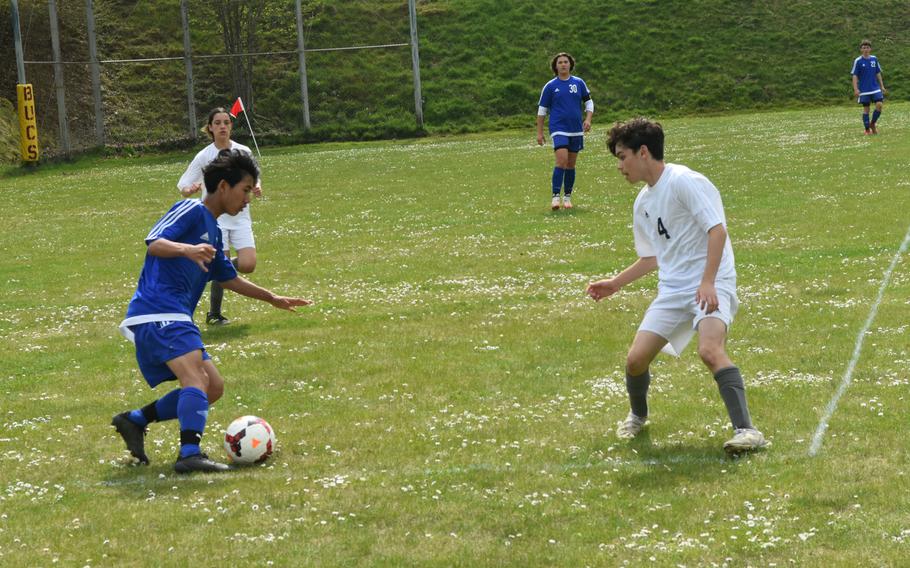 Hohenfels’ Nathan Bahgn attempts to get past Ansbach defender Easton Brock during a game in Baumholder, Germany, on Saturday, April 23, 2022. 