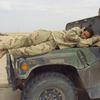 Hed: Catch 'm when you can, 2003

Highway 1, Iraq, Mar. 22, 2003: Spc. Stacy Miller of the Illesheim-based 2nd Squadron, 6th Cavalry Regiment grabs a few winks as the convoy of 11th Aviation Regiment units stops along Highway 1, near An Nasiriyah in southern Iraq. There were few opportunities for soldiers to sleep during the three-day trip from Camp Udairi, Kuwait, to 11th Aviation's new base in central Iraq, so they slept where and when they could.


Read the story on the convoy here.
https://www.stripes.com/history/2003-03-30/on-the-road-to-baghdad-1498960.html1


META TAGS: Operation Iraqi Freedom; Wars on Terror; U.S. Army; 