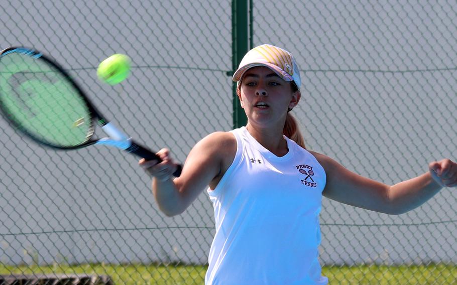 Matthew C. Perry's Ren Foslin hits a forehand return against E.J. King's Kana Fisher during Saturday's DODEA-Japan tennis matches. Foslin won 6-2.