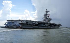 The aircraft carrier USS George H.W. Bush departs Naval Station Norfolk, Va., for a scheduled deployment, Aug. 10, 2022. 