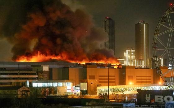 A massive blaze is seen over the Crocus City Hall on the western edge of Moscow on March 22, 2024.