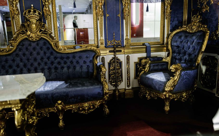 The elegant blue interior of King Ludwig II's rail car at the Deutsche Bahn Museum in Nuremberg, Germany. Its lavish furnishings offer a glimpse into royal rail travel of the past.