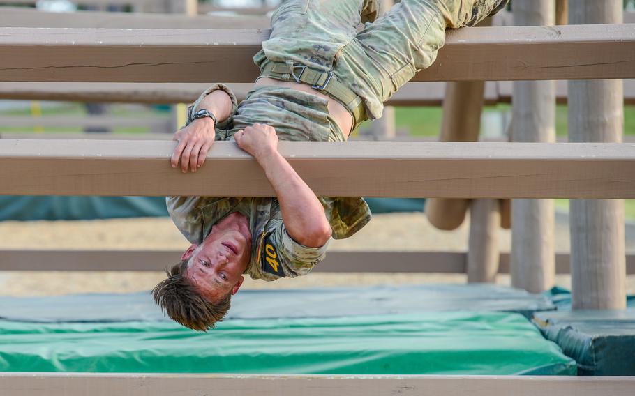 Army 1st Lt. Andrew Winski navigates an obstacle during the final day of the Army’s annual Best Ranger Competition on Sunday, April 14, 2024, on Fort Moore, Ga. Winski, a platoon leader in the 2nd Battalion, 75th Ranger Regiment, went on to win the competition with his partner, Sgt. Matthew Dunphy. 