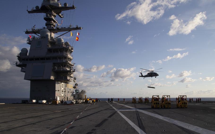 Sailors assigned to the first-in-class aircraft carrier USS Gerald R. Ford (CVN 78) and the “Tridents” of Helicopter Sea Combat Squadron (HSC) 9 conduct an ammunition onload, Sept. 25, 2022.