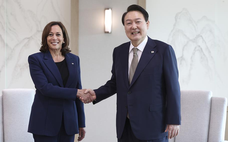South Korean President Yoon Suk-yeol shakes hands with U.S. Vice President Kamala Harris during their meeting at the presidential office on Thursday, Sept. 29, 2022 in Seoul, South Korea. 