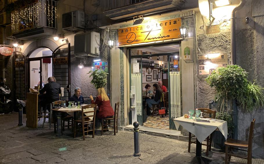 At Osteria da Tonino in Naples’ Chiaia neighborhood, outdoor dining tables are situated streetside, offering a chance to people-watch. 
