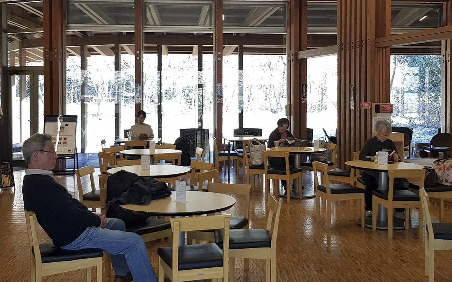 People relax at Cafe Seseragi inside Seoto-no-yu in Akiruno, Tokyo.